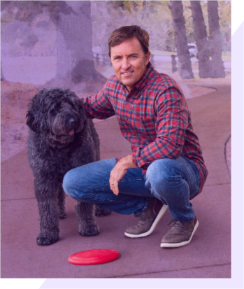 Man in plaid shirt with dog