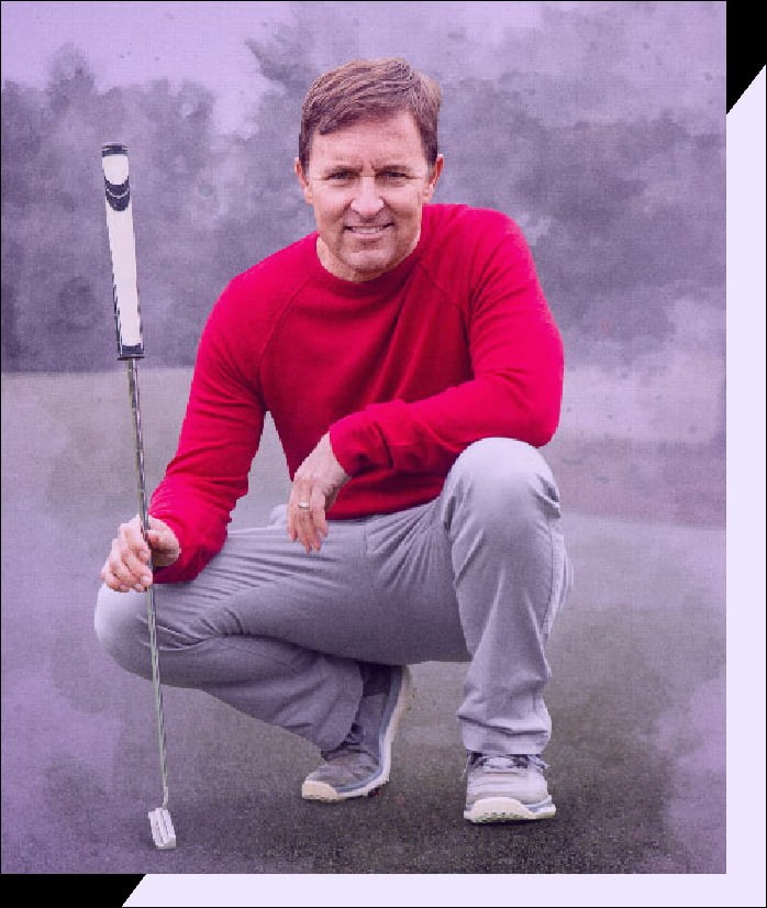 Man in red shirt playing golf